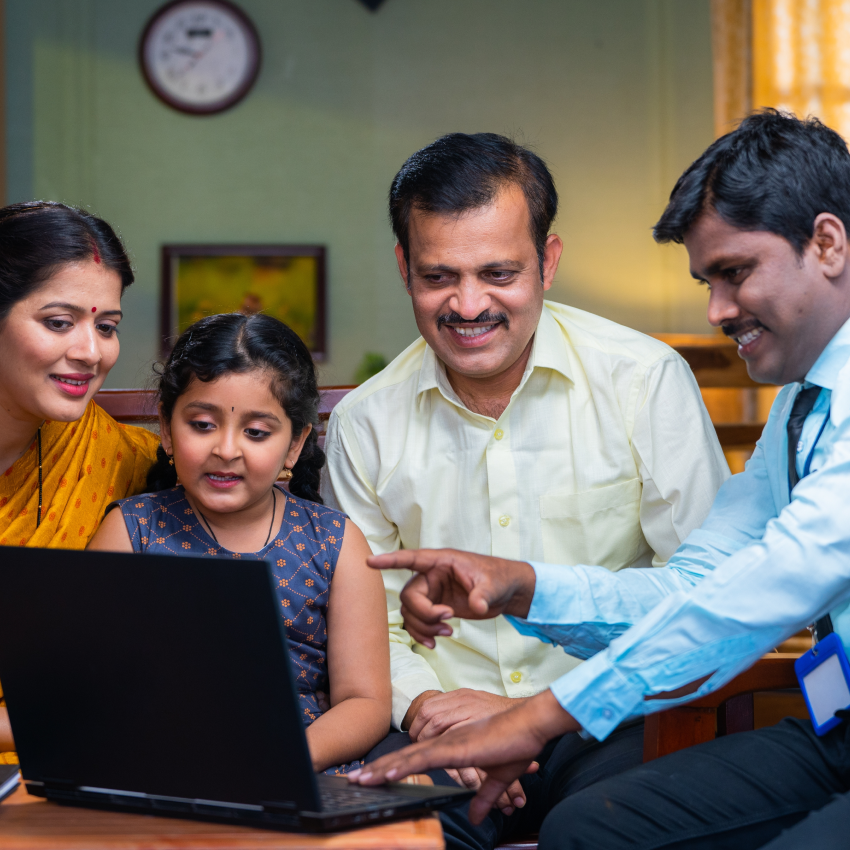 Insurance advisor explaining coverage options to secure client’s health, life, and assets.